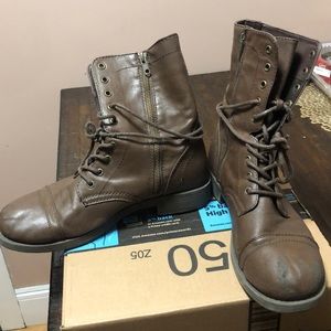 Brown worn combat boots